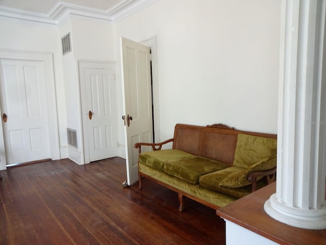 living area featuring dark hardwood / wood-style floors and ornamental molding