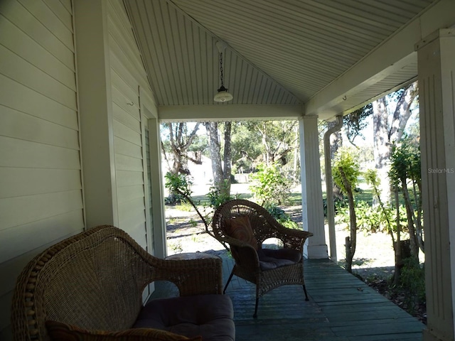 sunroom featuring lofted ceiling