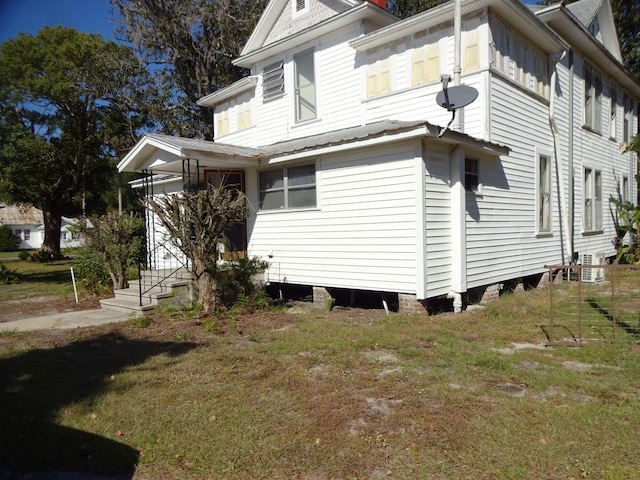 view of property exterior featuring a yard