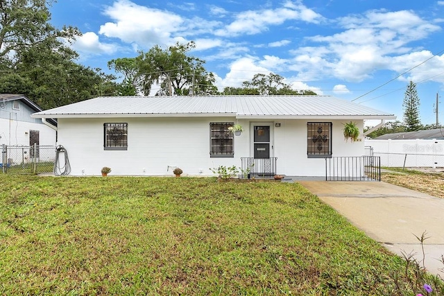 single story home featuring a front lawn and covered porch