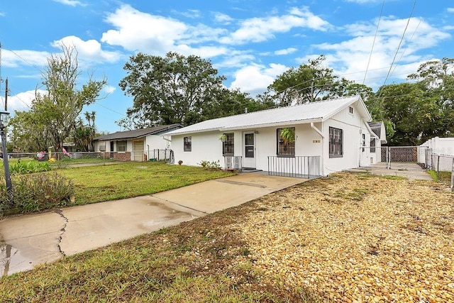 ranch-style home with a front yard