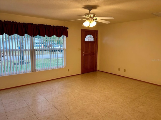 entryway featuring ceiling fan