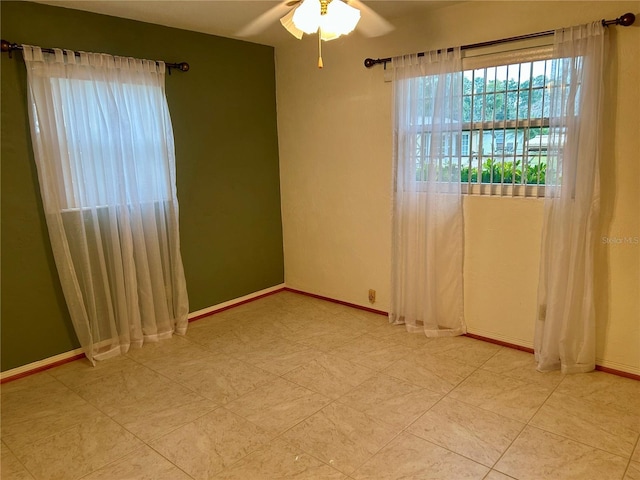 empty room featuring ceiling fan