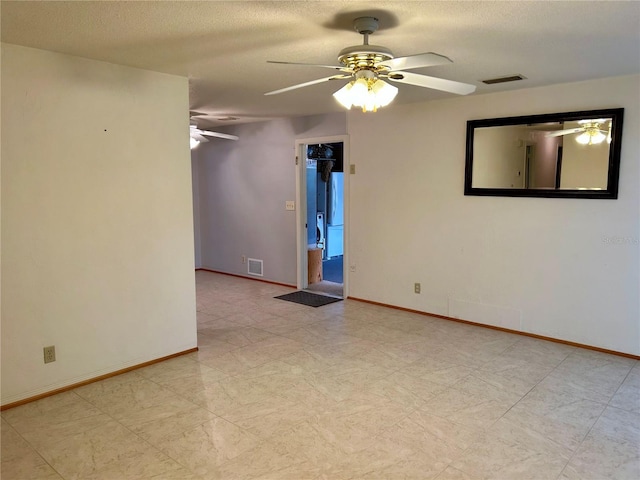 empty room featuring ceiling fan