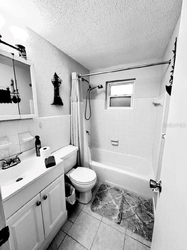 full bathroom featuring vanity, shower / tub combo, toilet, tile patterned flooring, and backsplash