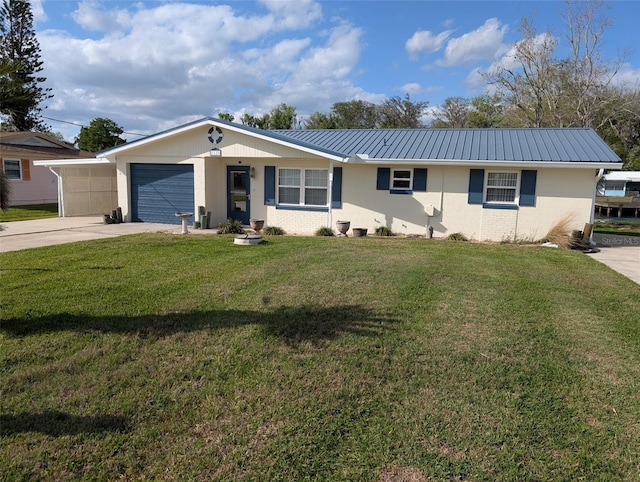 ranch-style house with driveway, a front yard, an attached garage, metal roof, and brick siding