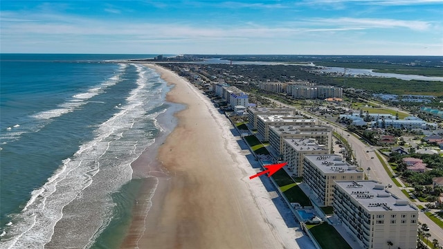 birds eye view of property featuring a view of the beach and a water view