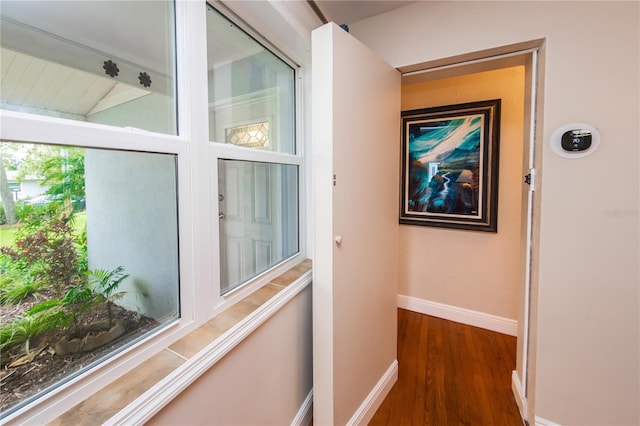 hall with dark hardwood / wood-style flooring