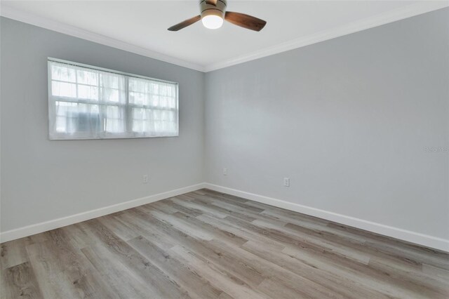 empty room featuring ornamental molding, ceiling fan, and light hardwood / wood-style floors