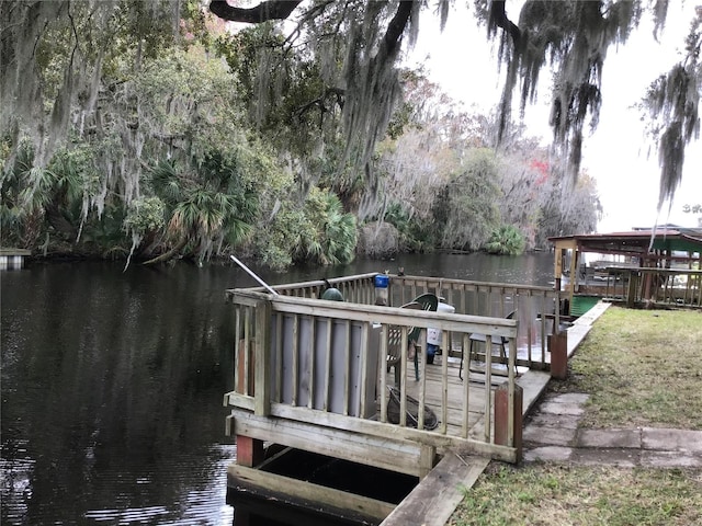 dock area featuring a water view