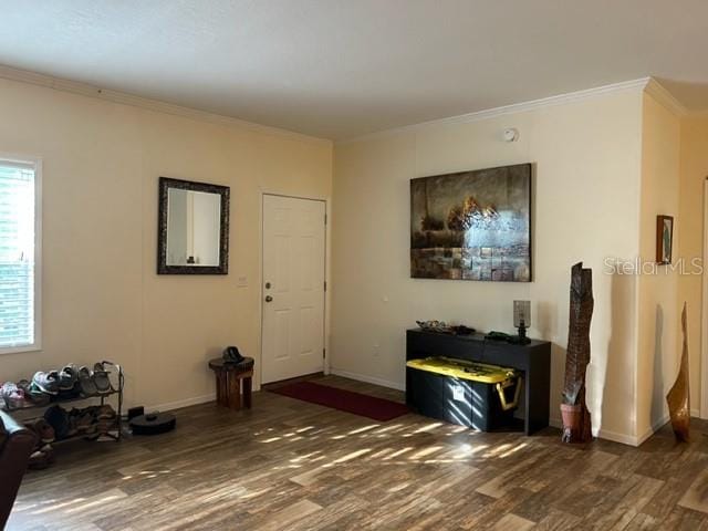 living room featuring ornamental molding and dark wood-type flooring