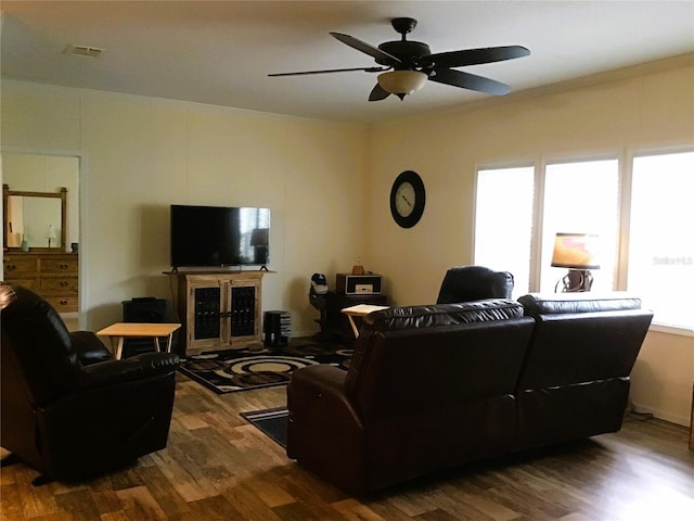 living room with ceiling fan and dark wood-type flooring