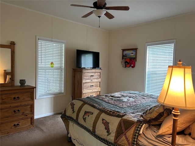 bedroom with ceiling fan and dark carpet