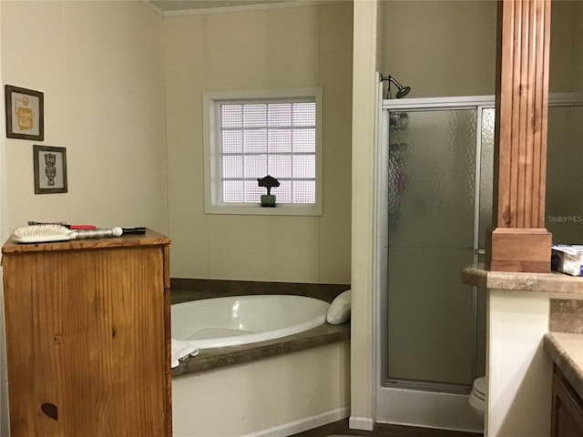 full bathroom featuring independent shower and bath, toilet, and vanity