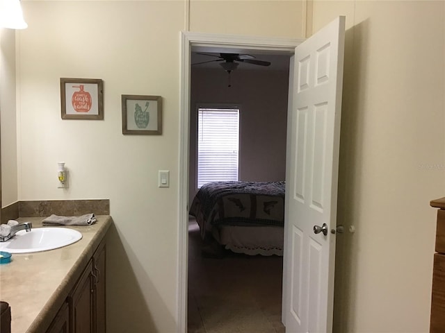 bathroom with tile flooring, ceiling fan, and vanity