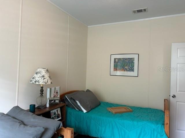 bedroom featuring ornamental molding