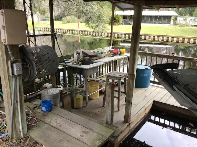 deck featuring a water view and a yard