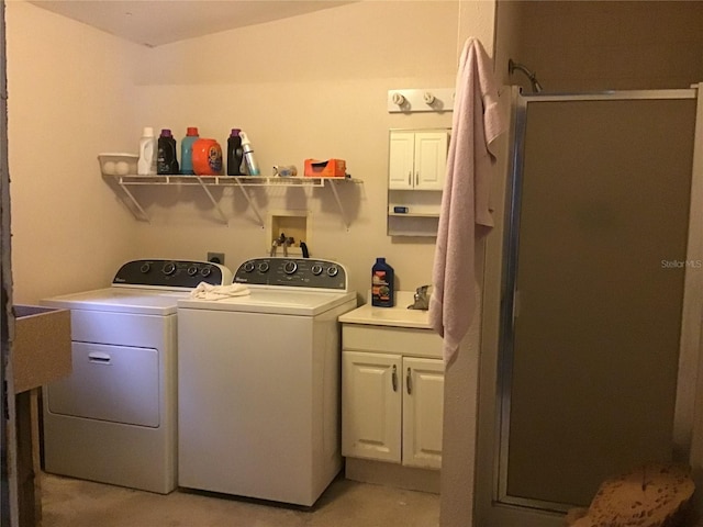 laundry room with cabinets and separate washer and dryer