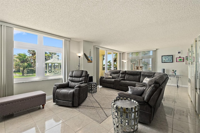 living room featuring light tile floors and a textured ceiling