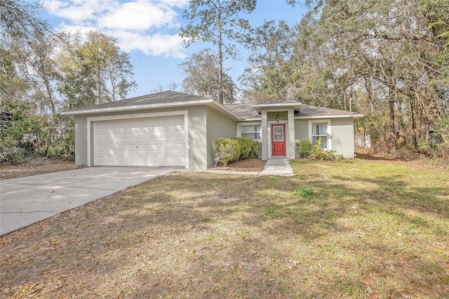 ranch-style house featuring a front yard and a garage