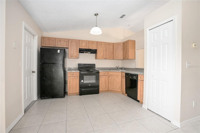 kitchen with sink, light tile flooring, black appliances, decorative light fixtures, and lofted ceiling