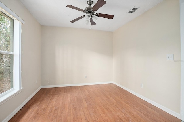 spare room featuring ceiling fan and light hardwood / wood-style flooring