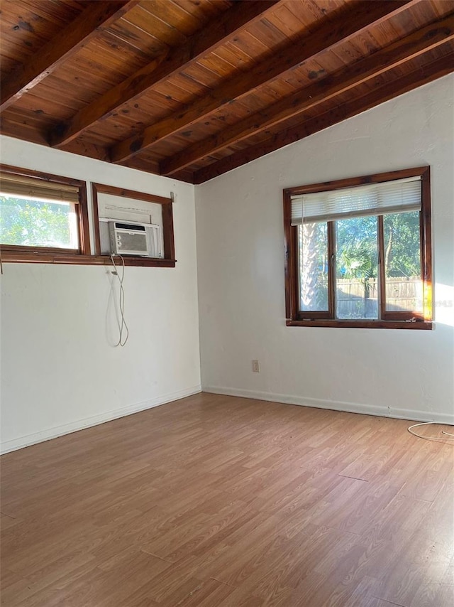 empty room with beamed ceiling, hardwood / wood-style flooring, cooling unit, and wood ceiling