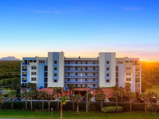 view of outdoor building at dusk