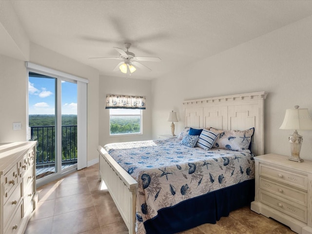 tiled bedroom featuring access to exterior and ceiling fan