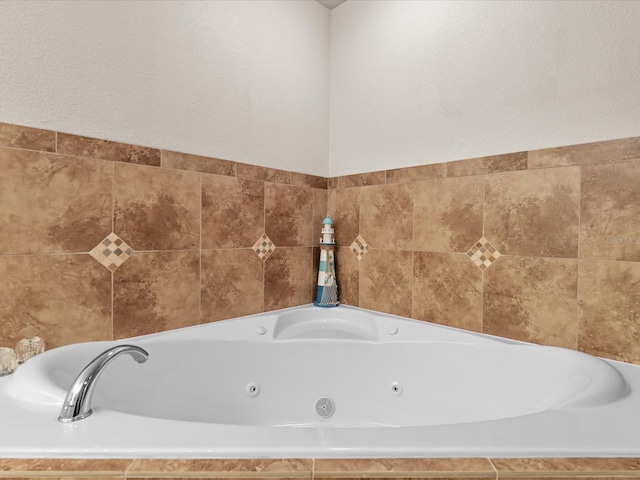 bathroom with tiled tub