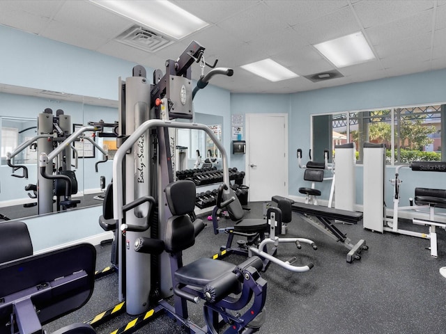 gym featuring a drop ceiling