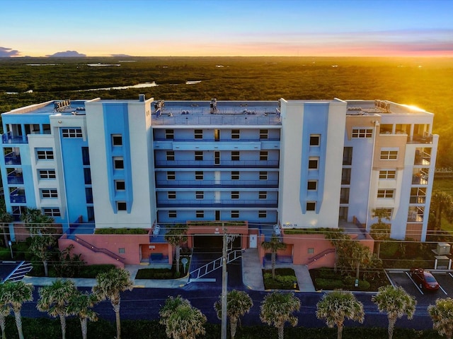 view of outdoor building at dusk