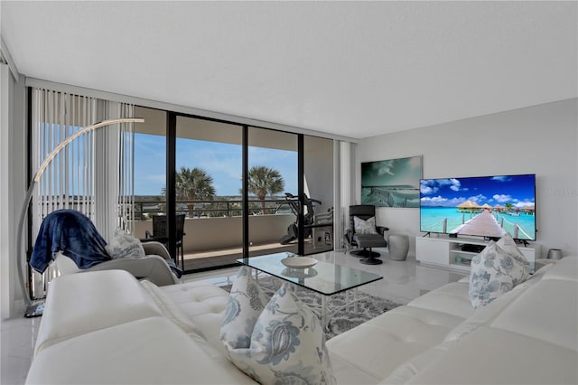 living room with expansive windows and a textured ceiling