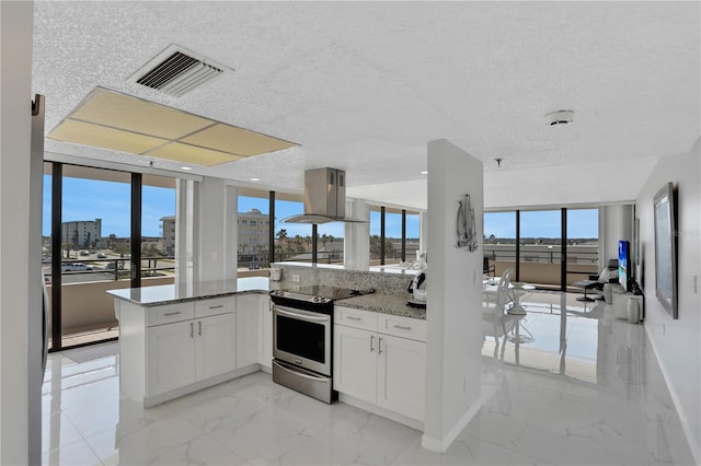 kitchen with white cabinets, light stone counters, electric range, and light tile flooring