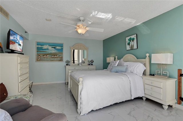 bedroom with light tile flooring, ceiling fan, and a textured ceiling