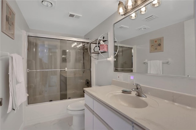 full bathroom with enclosed tub / shower combo, toilet, large vanity, and tile floors