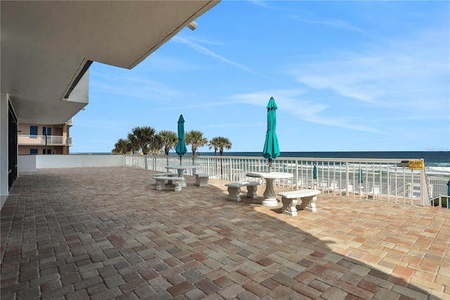 view of terrace featuring a water view and a balcony