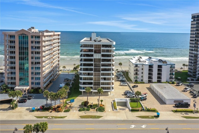 exterior space featuring a beach view and a water view