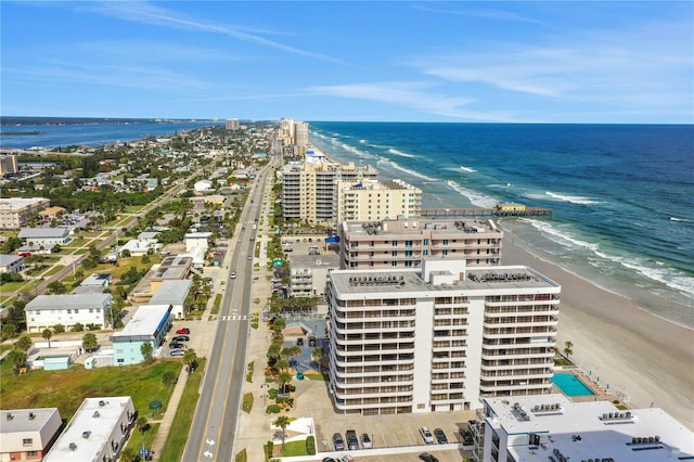 bird's eye view featuring a water view and a view of the beach