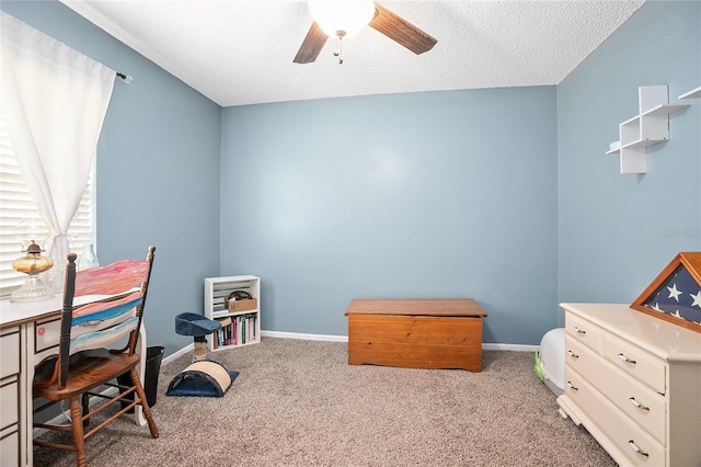 office area with light colored carpet, ceiling fan, and a textured ceiling