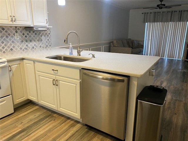 kitchen featuring sink, ceiling fan, dishwasher, tasteful backsplash, and light wood-type flooring