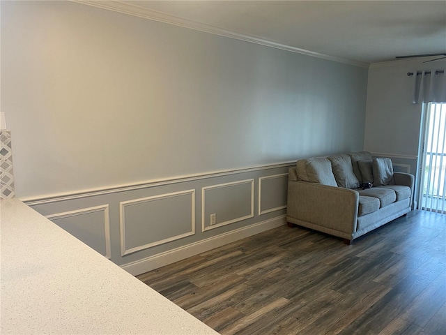 unfurnished living room with crown molding and dark hardwood / wood-style flooring