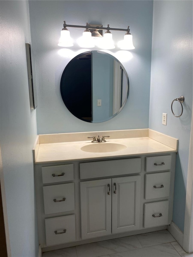 bathroom with vanity with extensive cabinet space and tile flooring