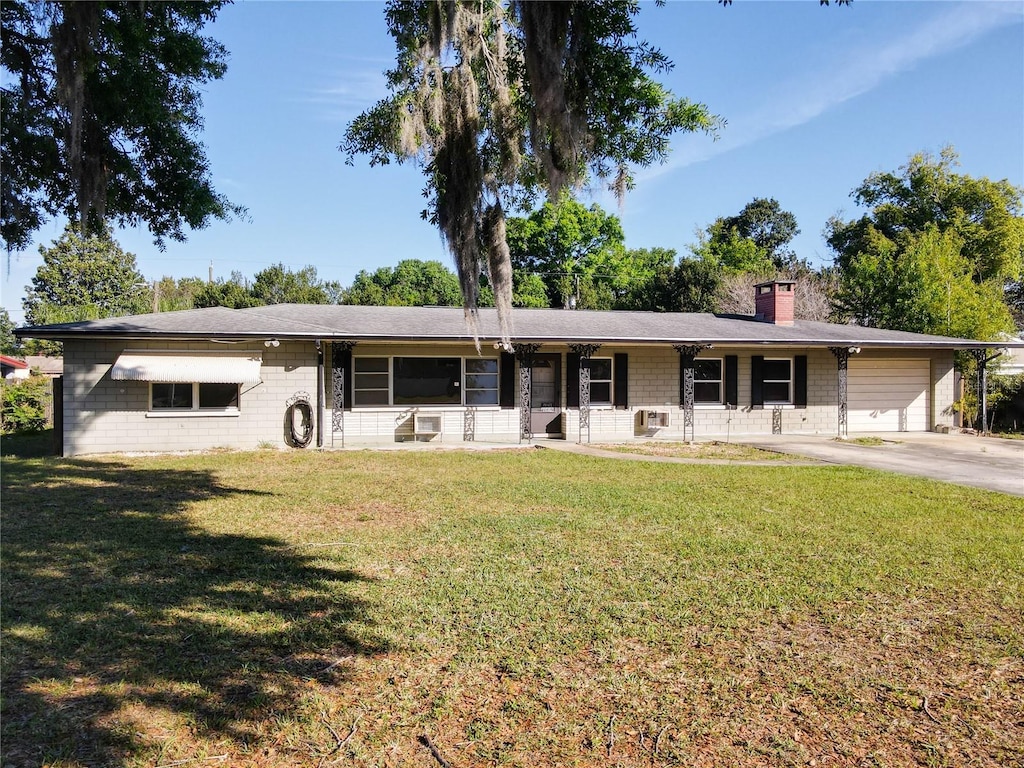 ranch-style home with a front lawn and a carport