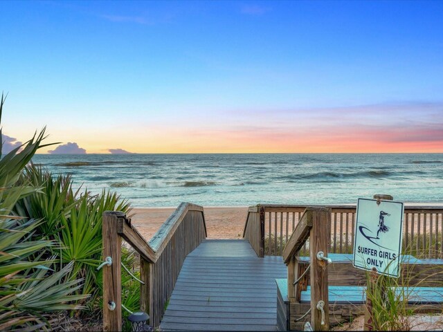 view of community with a view of the beach and a water view