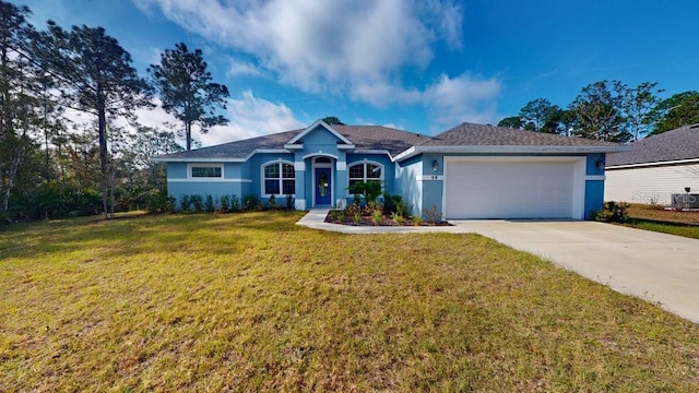 single story home with a garage and a front yard