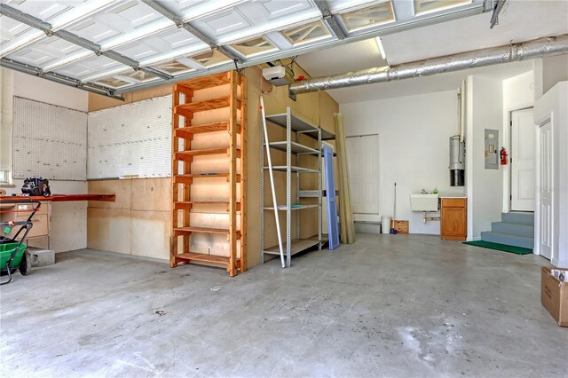 garage featuring a garage door opener and sink