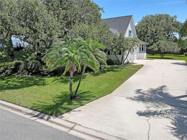 view of home's exterior with a yard