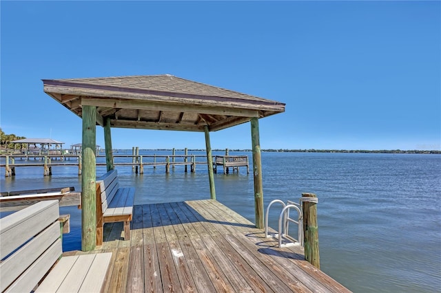 view of dock with a water view