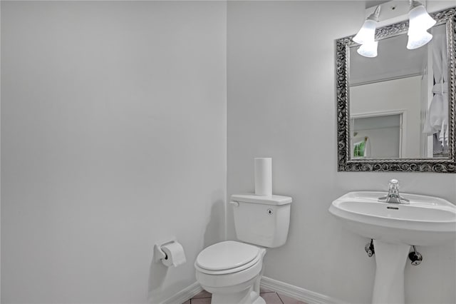 bathroom featuring tile patterned floors and toilet